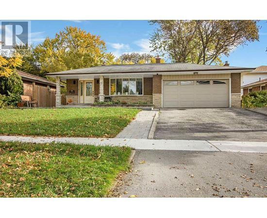 A house with a garage and a driveway in front.