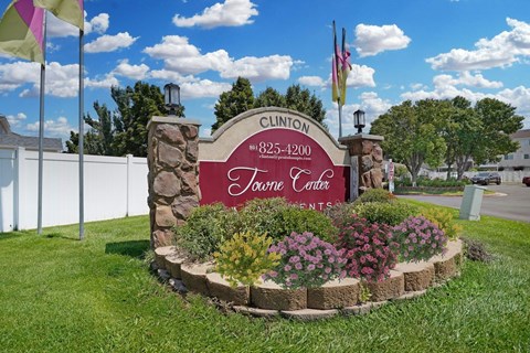 Clinton Tournee Centre sign with flowers in front.