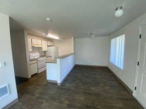 A kitchen area with a counter and cabinets.