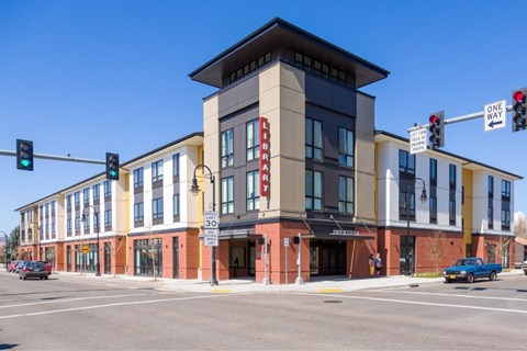 A building with a red brick facade and a sign that says "Theater" on it.