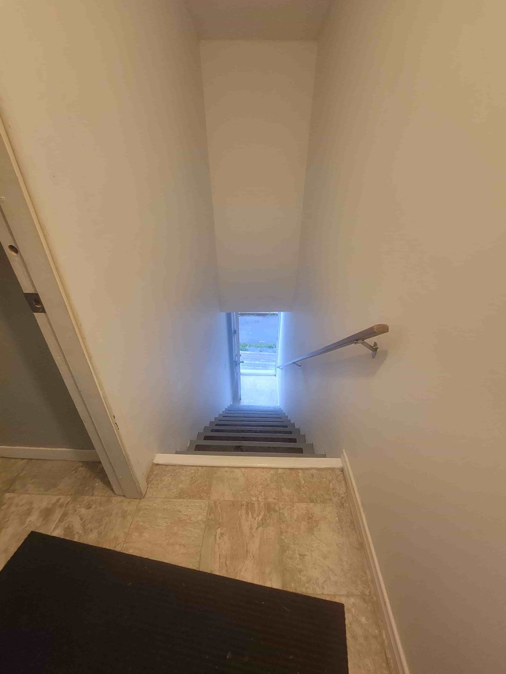 A stairway with a light at the top.