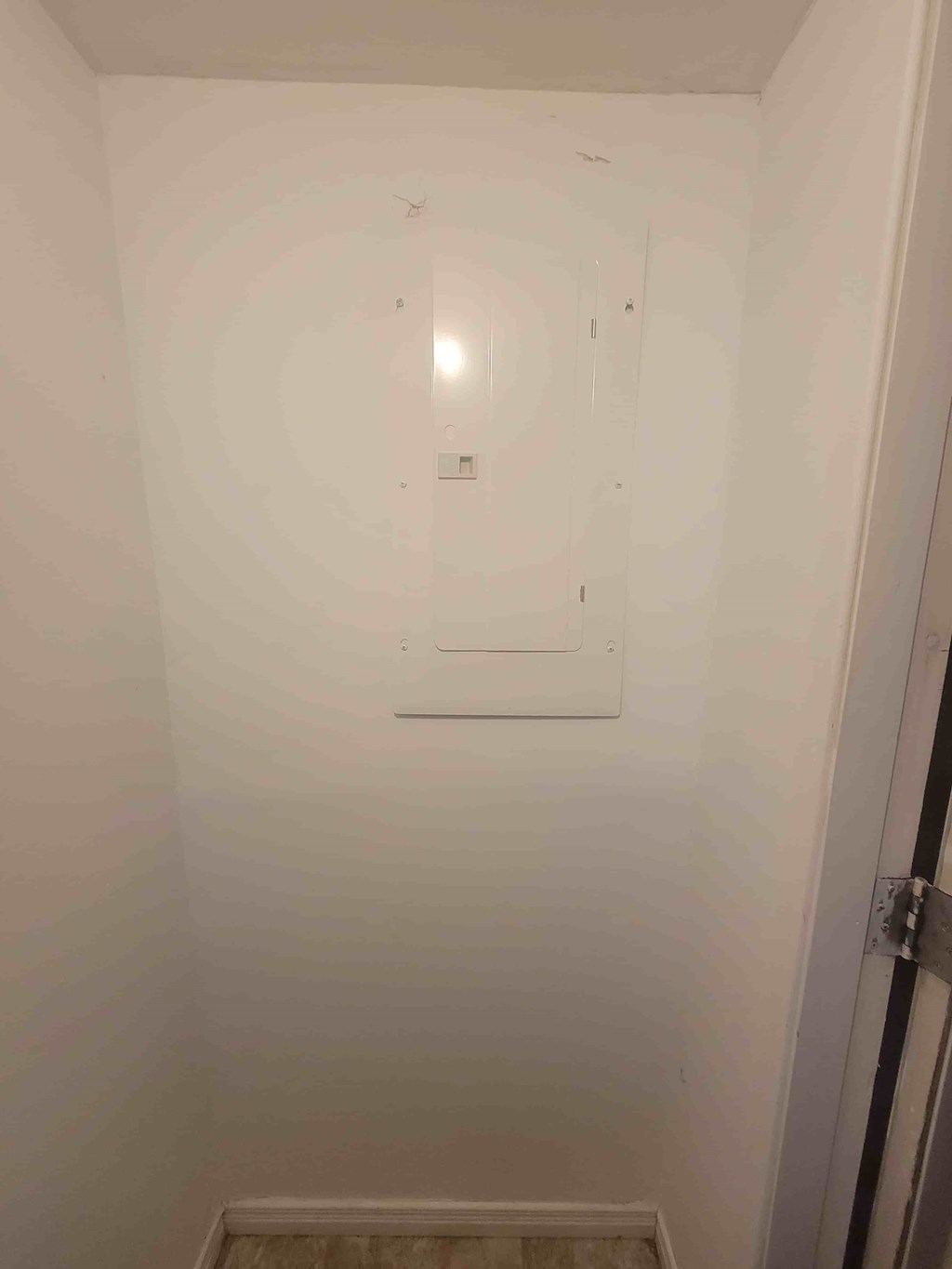 A white bathroom with a toilet and sink.