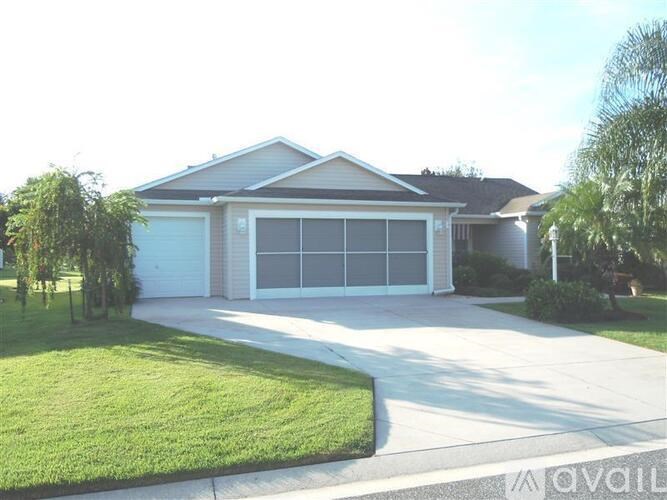 A house with a white garage door and a driveway.