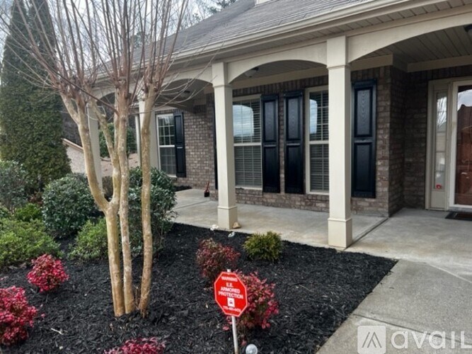 A house with a red stop sign in front of it.