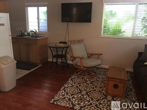 A living room with a chair and a table.