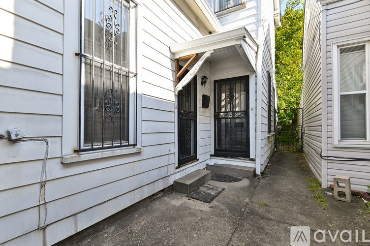 A white house with a black door and window.