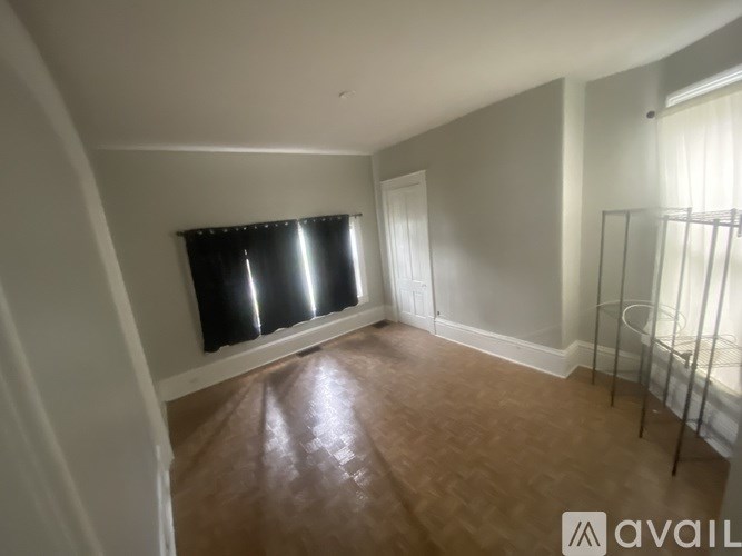 A room with a window and a door.