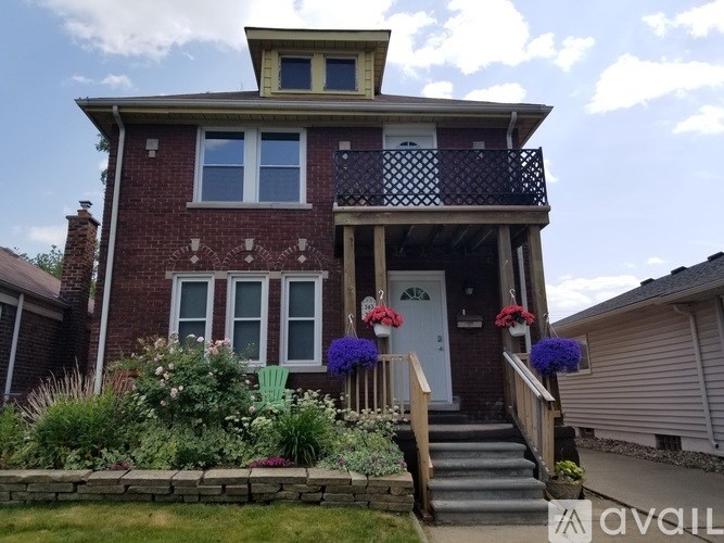 A house with a red brick exterior and a white door.