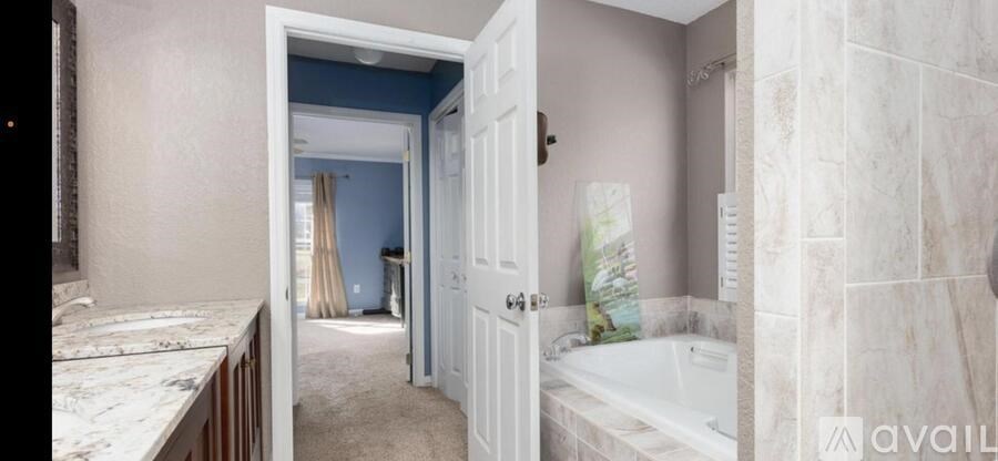 A bathroom with a tub and a sink.