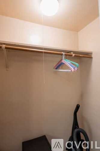 A hanger with a striped shirt hanging on it.