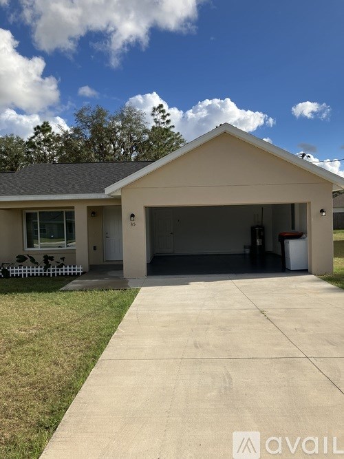 A house with a garage and a driveway.