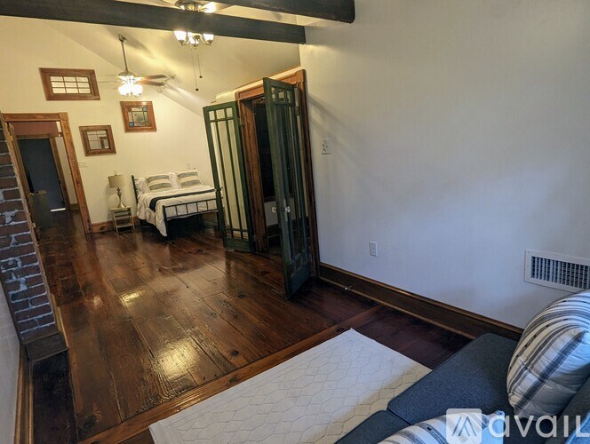 A room with a bed and a couch in it.