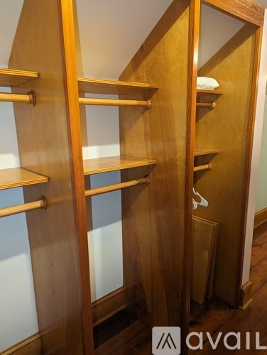 A wooden shelving unit with a white background.