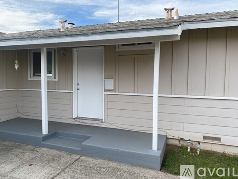 A house with a white door and a porch.