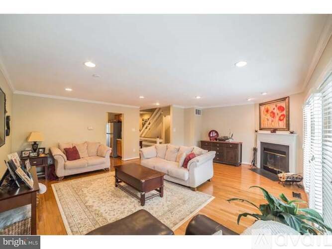 A living room with a fireplace and a couch.