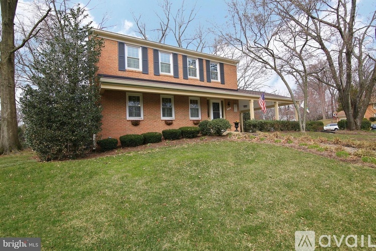A house with a lawn in front of it.