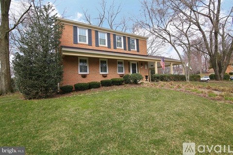 A house with a lawn in front of it.