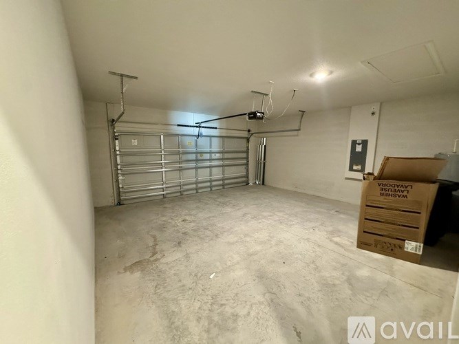 A large empty room with a box on the floor.