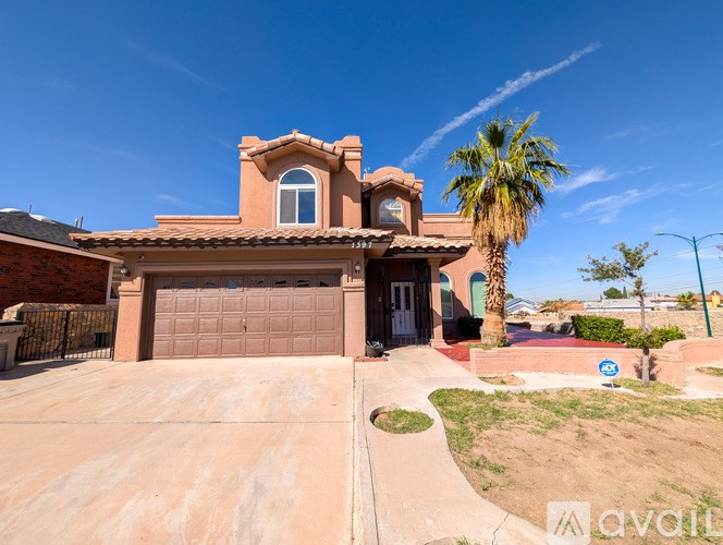 A house with a brown roof and a palm tree in front.