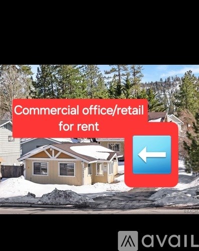 A house with a sign that says "Commercial office/retail for rent".