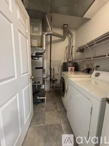 A laundry room with a washer and dryer.