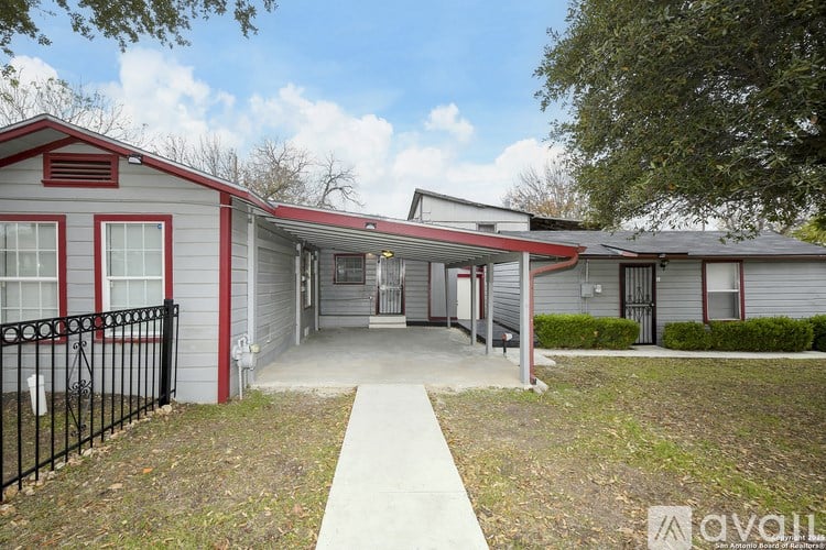 A small building with a red roof and a sign that says "available" in front of it.