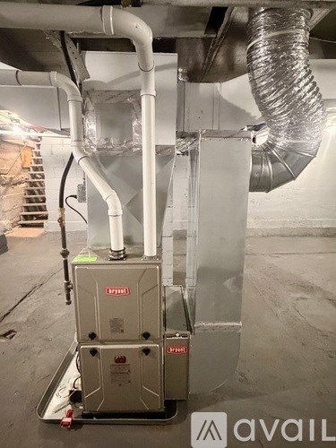 A large industrial air handling unit with pipes and ducts.