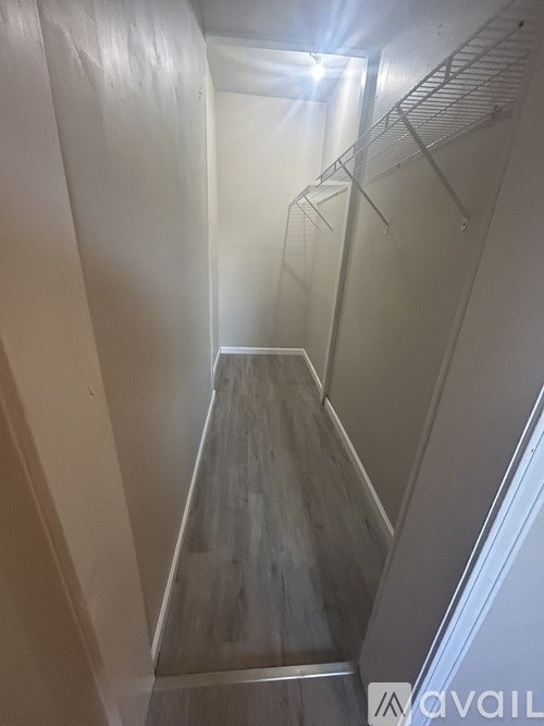 A long hallway with a light at the end.