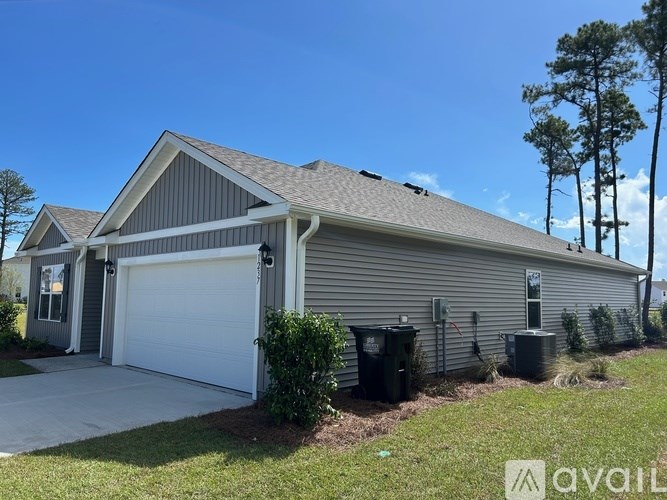 A house with a garage and a driveway.