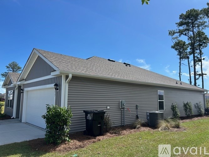 A house with a garage and a driveway.