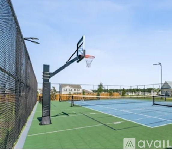 A basketball court with a hoop and a net.