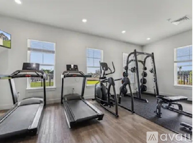 A well-equipped home gym with treadmills, weights, and exercise machines.