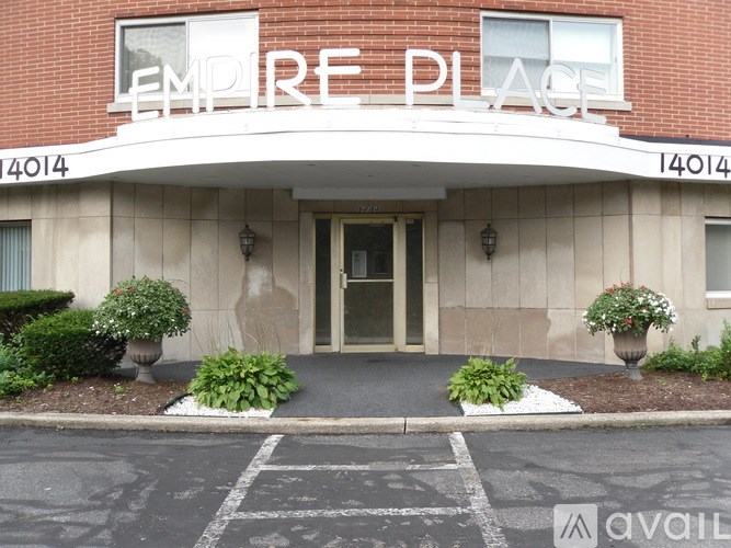 The front of a building with the name "Empire Place" on it.