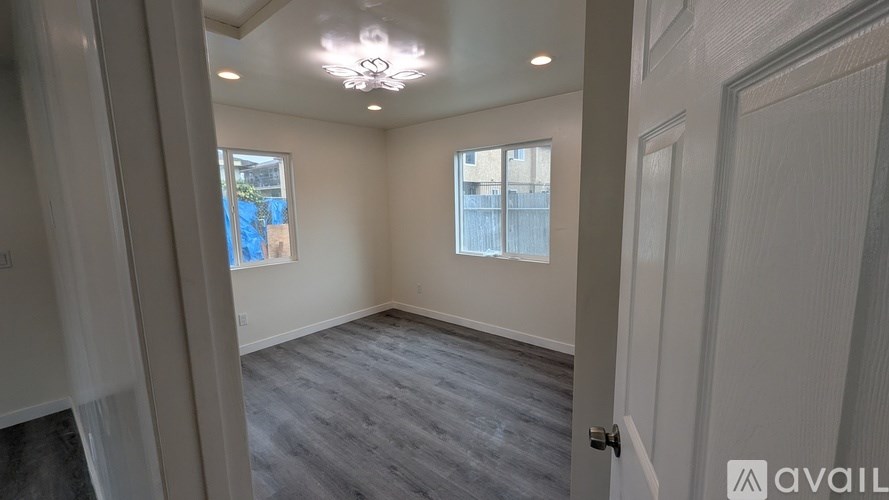 A room with a door and a window.