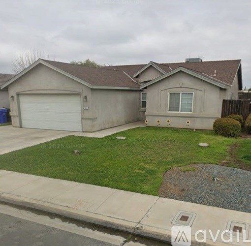 A house with a garage and a driveway.