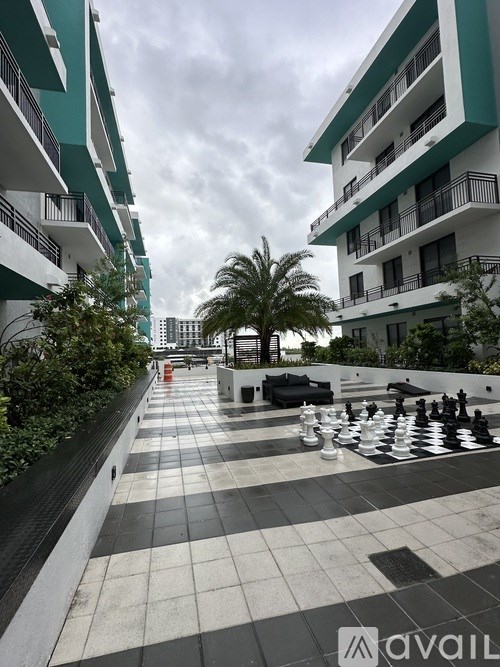 A chess board is set up on a balcony.