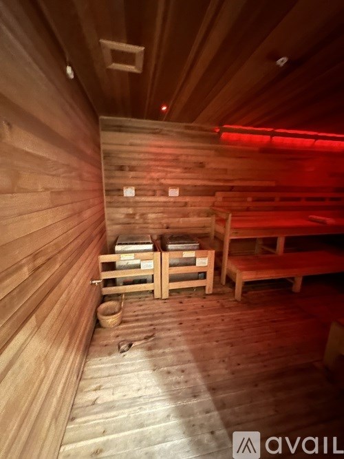 A sauna with wooden walls and benches.