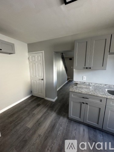 A kitchen with a counter top and cabinets.