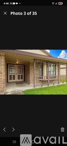 A house with a brown door and windows is shown.
