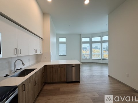 A kitchen with wooden cabinets and a sink.