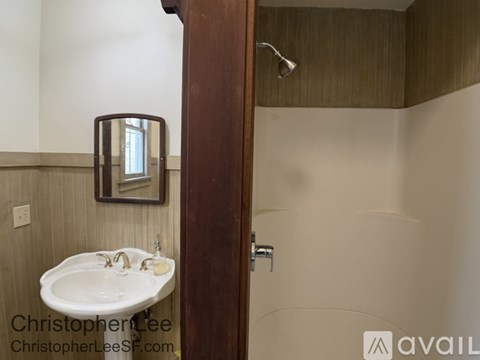 A bathroom with a sink and mirror.