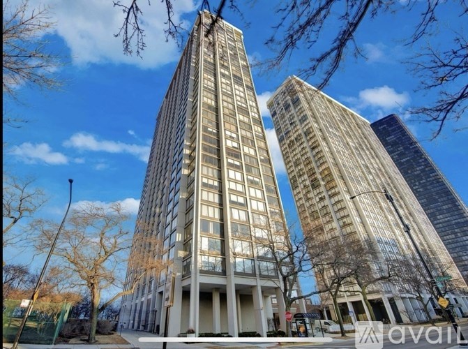 Two tall buildings are seen in the image.