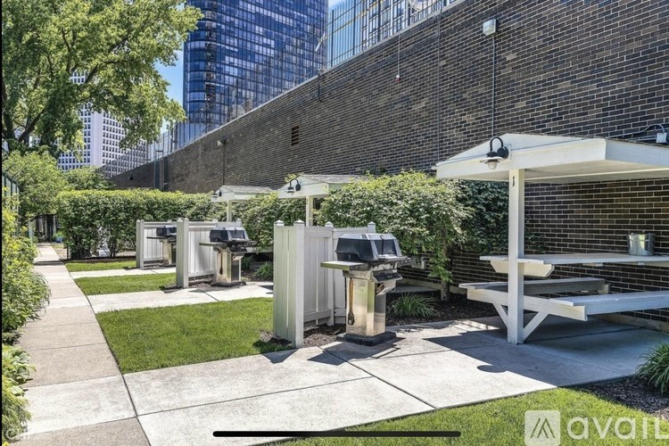 A patio area with a table and chairs is set up outside a building.