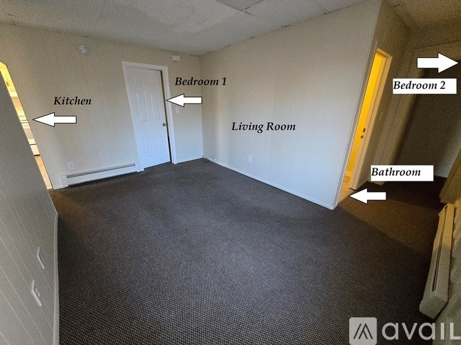 A living room with a kitchen and two bedrooms.