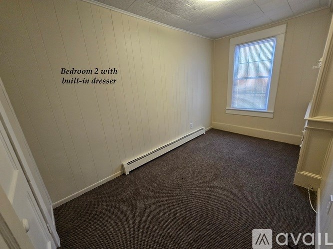 Bedroom 2 with built-in dresser.