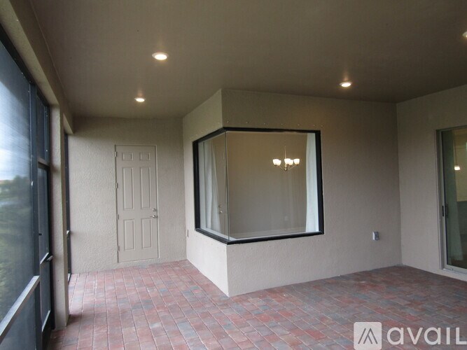 A room with a tiled floor and a large mirror on the wall.