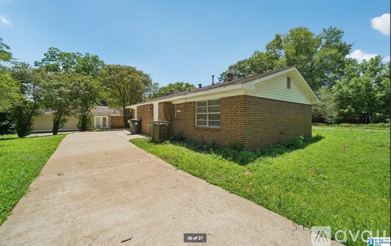 A house with a driveway in front of it.