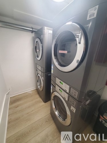 A row of washing machines in a laundromat.