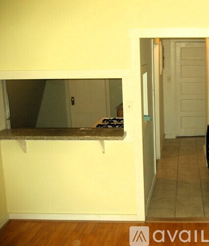 A room with a counter and a door.