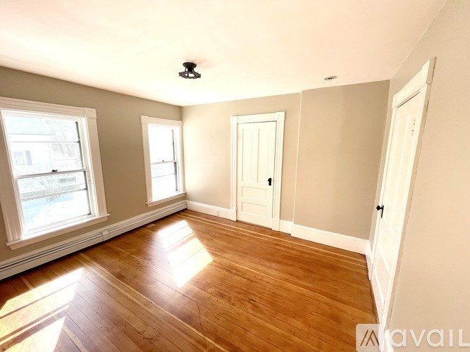 A dining room with a table set for two.